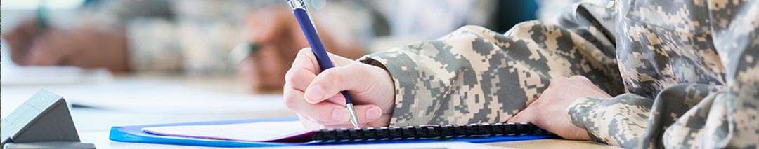 student wearing camouflage studying