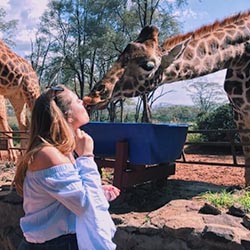 michaella caruso and a giraffe